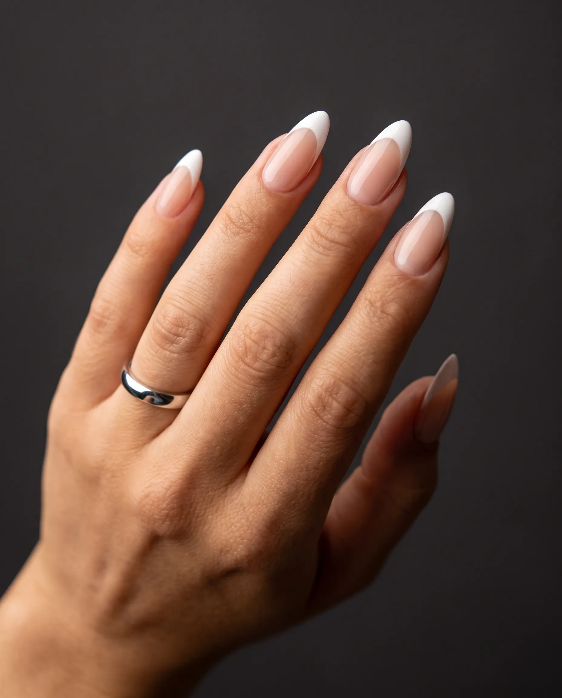 Modern white French tips on a sheer nude base